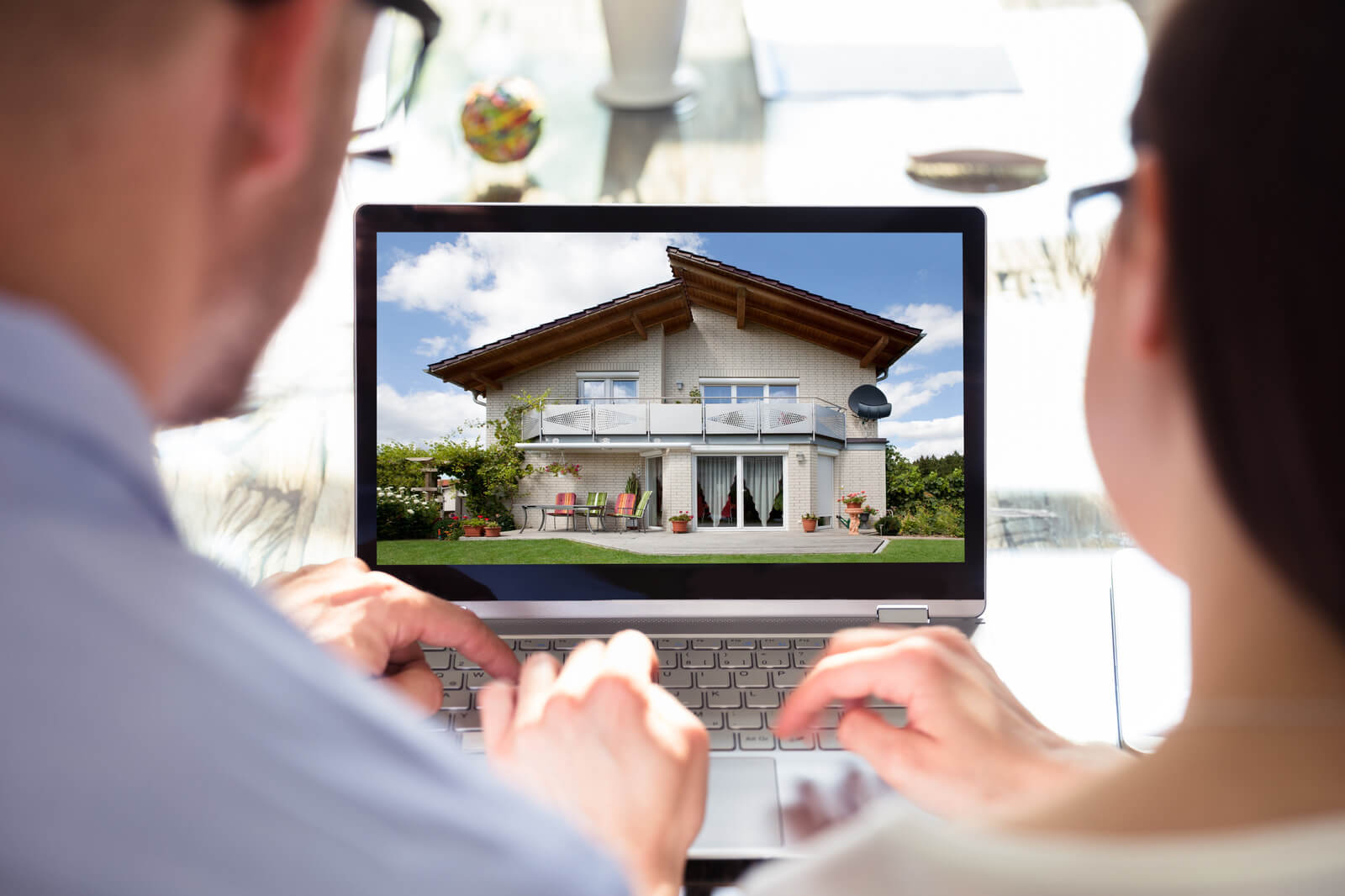 Canva Two Businesspeople Looking At House 1